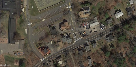 This figure is an aerial photo showing the improved streets, sidewalks, and crosswalks near the front entrance of Manchester Memorial Elementary School.